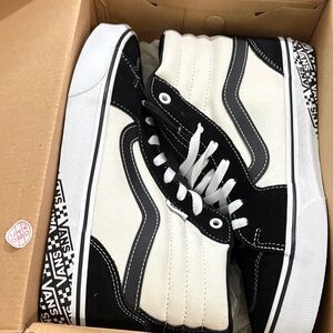 Vans Black and Cream High-Tops